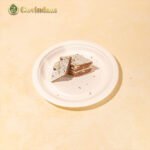 Elegant Anjeer Katli gift box revealing neatly arranged sweet pieces