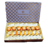 Mix Box 1kg - Kaju Katli, Pinni, Moong Barfi & Pista Roll