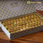 Anjeer Cake pieces served on silver platter with festive decorations