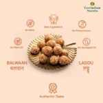 Close-up of Balwan Laddu showing dense texture, nuts, and ghee coating