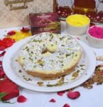 Meetha Ghewar served on silver thali with marigold flowers and festive elements