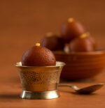 Close-up of soft and juicy Gulab Jamun soaked in sugar syrup