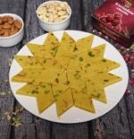 Kesar Katli served on a silver platter with festive décor