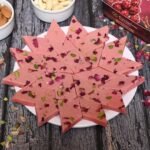 Close-up of Fresh Rose Katli with soft pink color and rose petal garnish