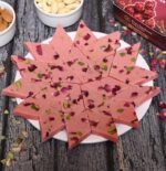 Close-up of Fresh Rose Katli with soft pink color and rose petal garnish