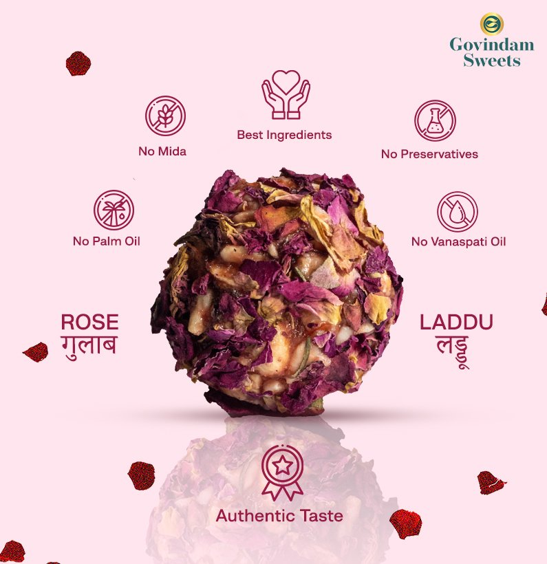 Close-up of pink Rose Laddu garnished with rose petals and silver varak